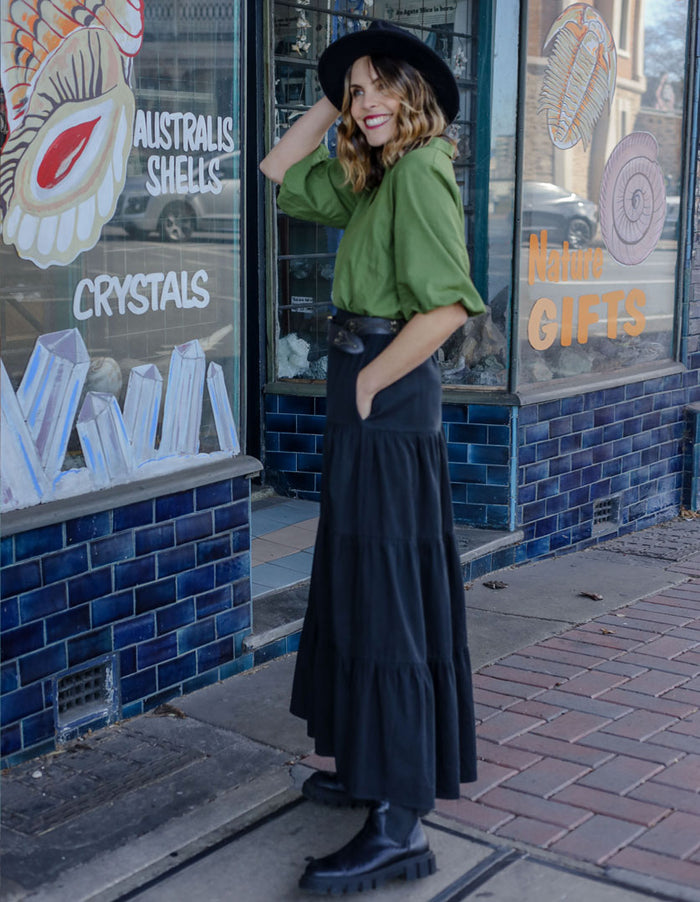 DEVOI Black cotton cord skirt. Maxi tiered skirt. Side view