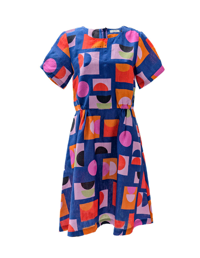 DEVOI Audrina Dress in Just Pretend Blue printed linen. A new version of best selling Dorothy dress. With a blue background and red, orange and pink accents. Front view.