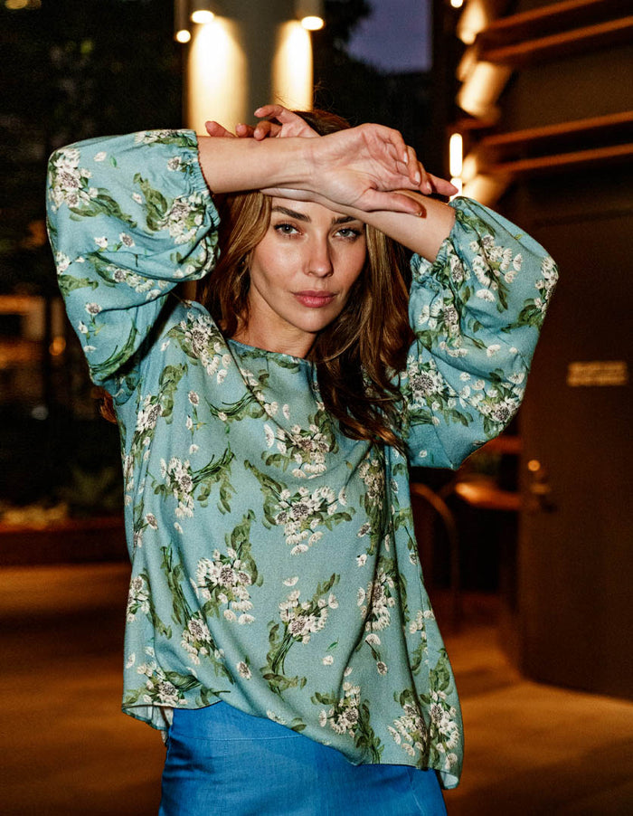 DEVOI Bea top. Blue floral printed long sleeved top with modal crepe. Front view on model.