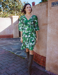 DEVOI wrap dress printed Calla Lilies green. Front view on model