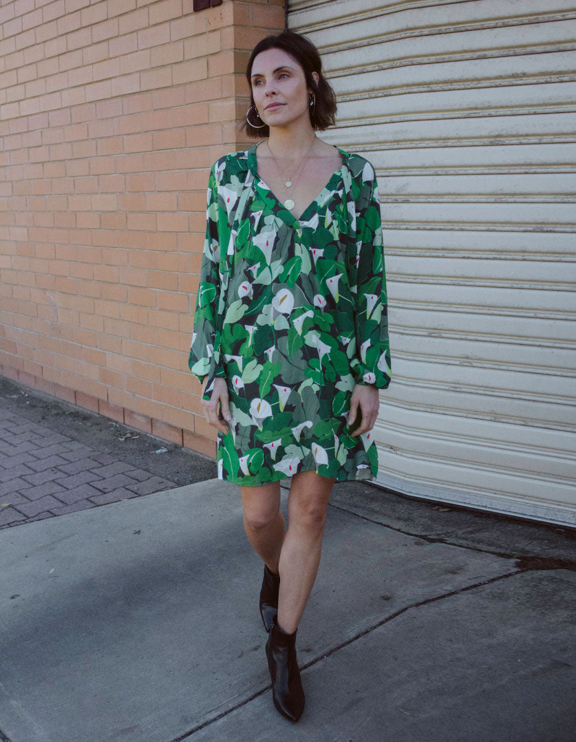 DEVOI Georgia dress in Calla Lilies green print. Knee length with full length sleeves. Front view