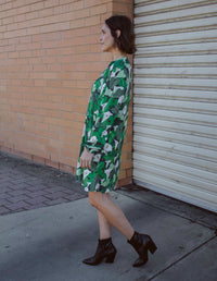 DEVOI Georgia dress in Calla Lilies green print. Knee length with full length sleeves. Side view