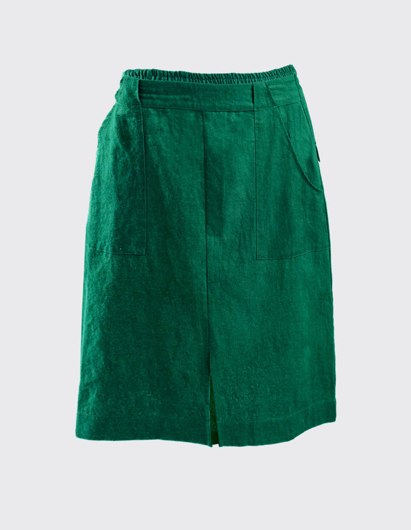 DEVOI Maya skirt in Emerald Green Linen. 100% Linen. Elasticated back waist with a flat front waist. CF split. Large patch pockets. Back patch pockets. Front view.