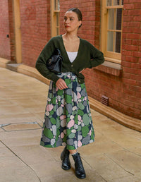 DEVOI Printed Kathleen linen skirt in a green pebbles print. Midi length with pocket and an elasticated waistband. Front view