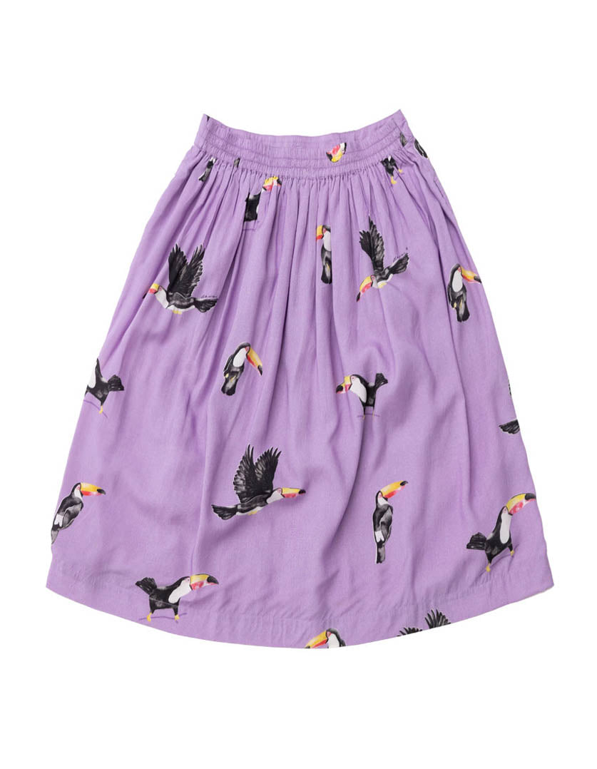 DEVOI Lilac I Can Toucan printed Margot skirt. Midi skirt with a back elasticated waistband and pockets. Back flat lay view