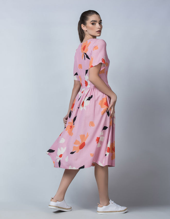 DEVOI Lilac Magnolia printed Dorothy dress in linen. Side back view on model.