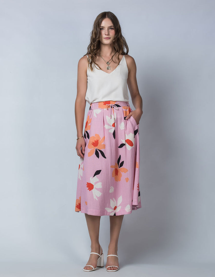 DEVOI Lilc Magnolia printed linen Kathleen skirt with an elasticated waistband and pockets. Front view