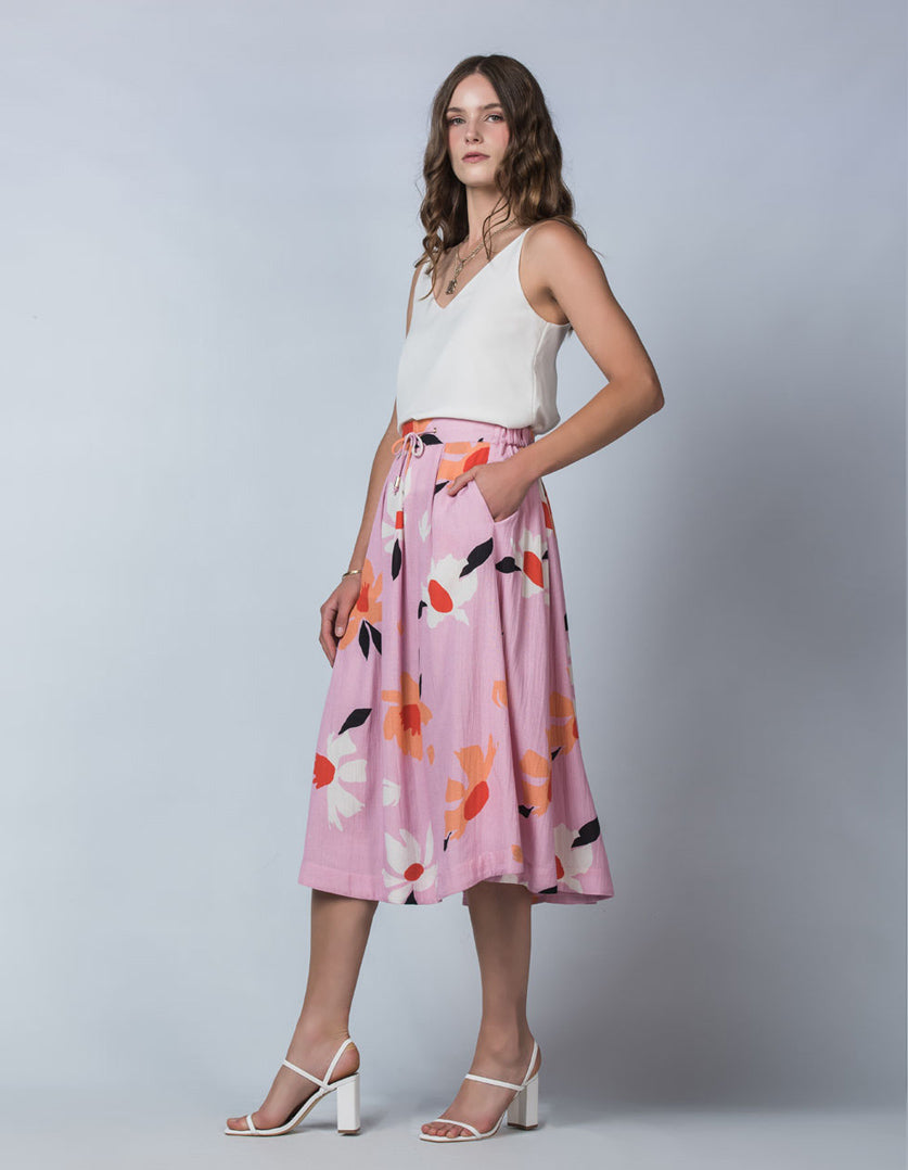 DEVOI Lilc Magnolia printed linen Kathleen skirt with an elasticated waistband and pockets. Side view