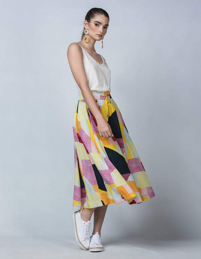 DEVOI Kathleen skirt in the Patchwork printed linen. Elasticated waistband, pockets. Midi length. Side view