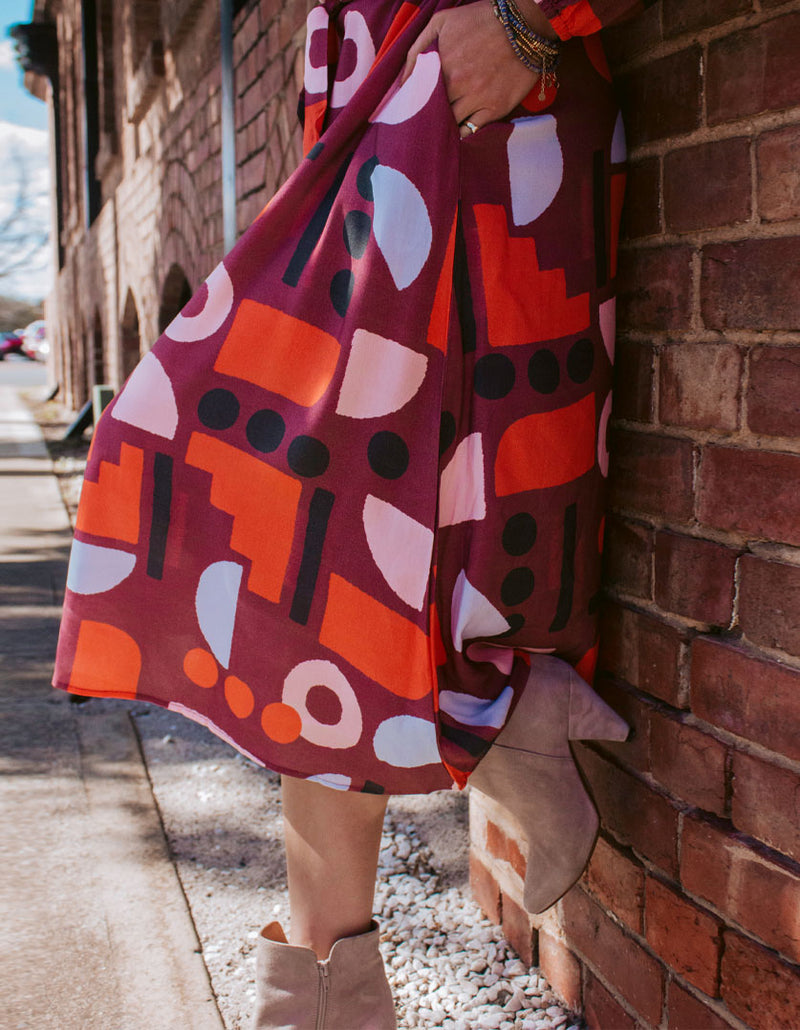 DEVOI Sybille dress in Block Party printed rayon. Front skirt close-up view.