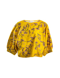 DEVOI Scalavender printed linen top with batwing sleeves. Boat neckline. Mustard and purple print. Front view