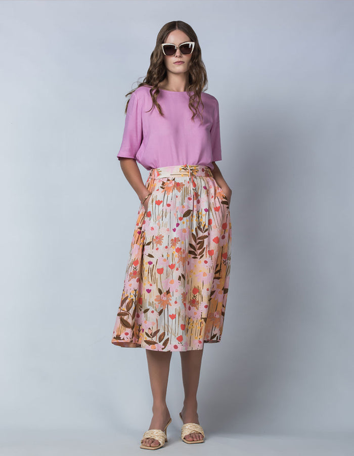 DEVOI Kathleen skirt in the pink Meadow printed linen. Front view on model