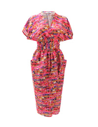 DEVOI Kinsley dress in pink Mosaic printed linen. Wrap dress with a v-neck and short sleeves. Wide waistband. Patch pockets. Front view.