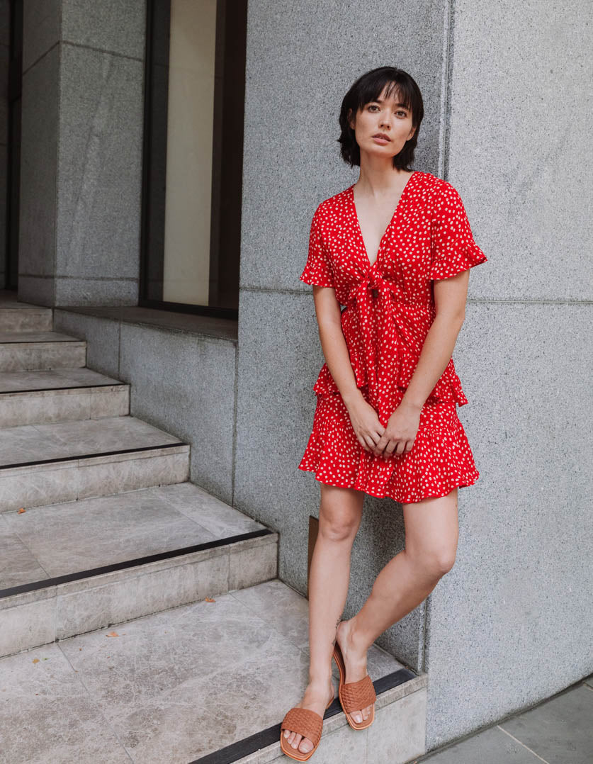 DEVOI dotty red Ellen dress with a v-neck and front tie. Mini dress.