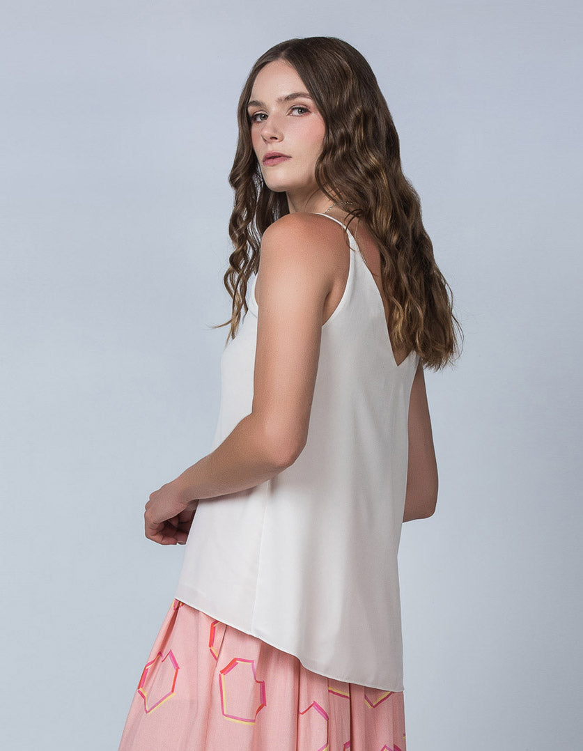 DEVOI Bobby top in cream modal crepe. V-neck vest top with thin straps. Back view on model