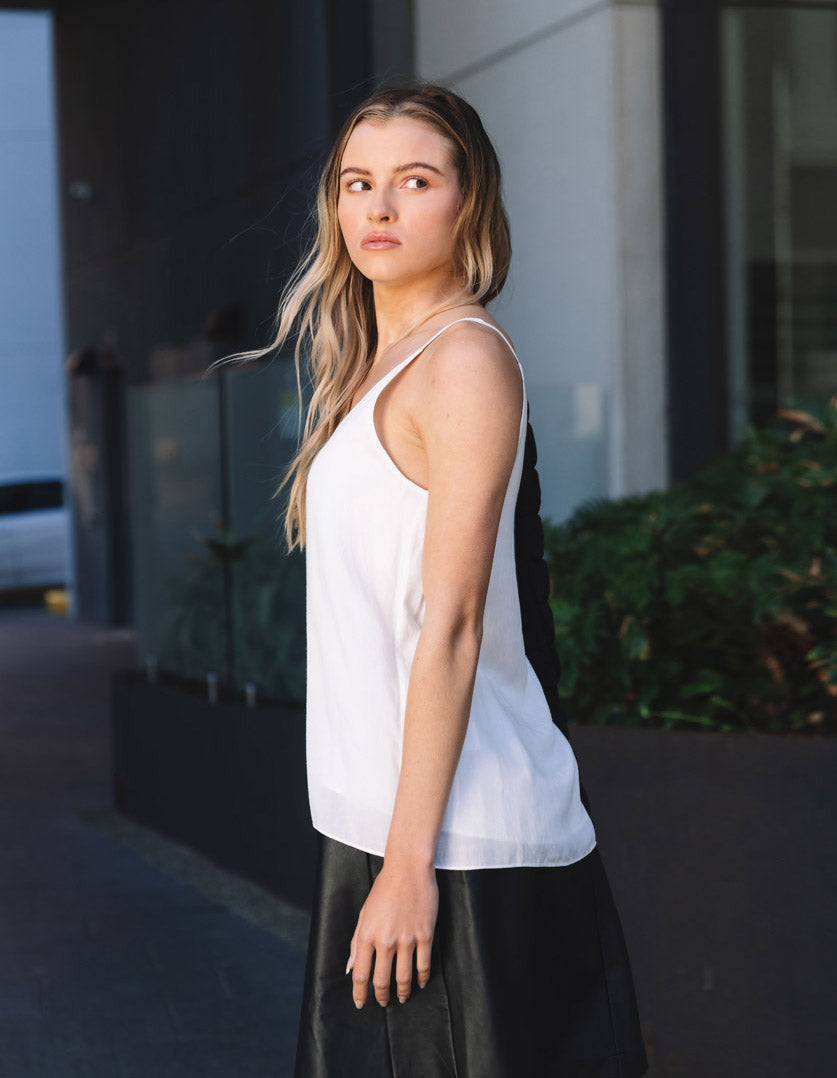 DEVOI Bobby top in cream modal crepe. V-neck vest top with thin straps. Side view